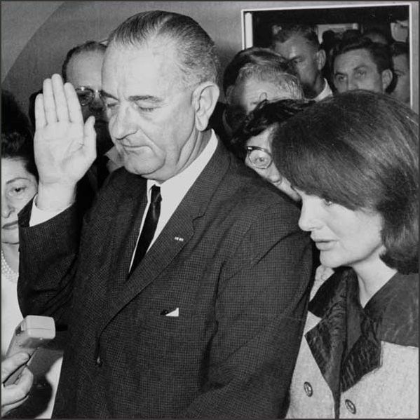 Lyndon Johnson is sworn in as President aboard Air Force One